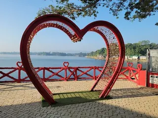 A heart-shaped arch on a lakeside viewpoint in Rangamati